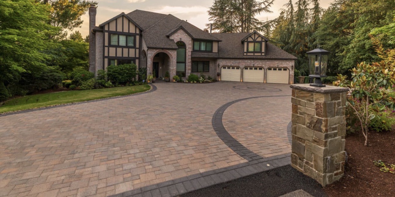 Premium block paved driveway sweeping up to a large family home